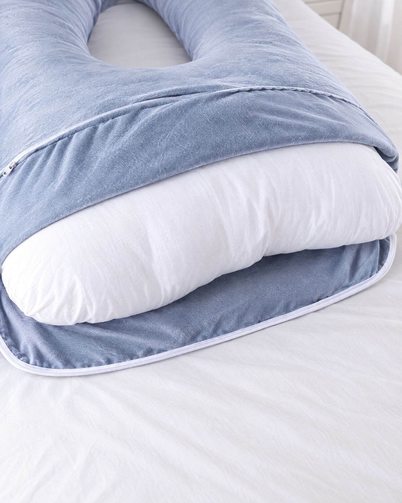 Velvet cover unzipped to show the white inner cushion